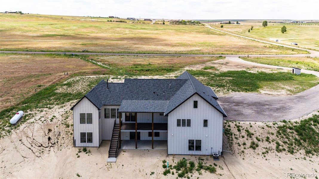 Front exterior of a new home in , Byers, CO, highlighting curb appeal (Image 2).