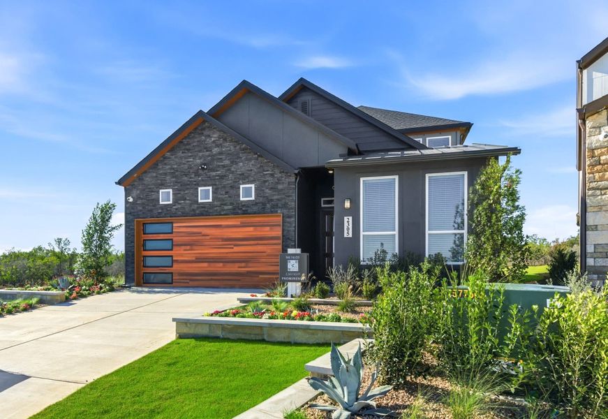 Front exterior of a new home in Prominence – Now Selling, San Antonio, TX, highlighting curb appeal (Image 24). Front exterior of a new home in Prominence – Now Selling, San Antonio, TX, highlighting curb appeal (Image 24).