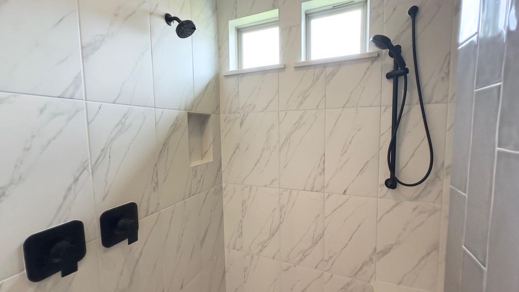 Bathroom view of tiled shower