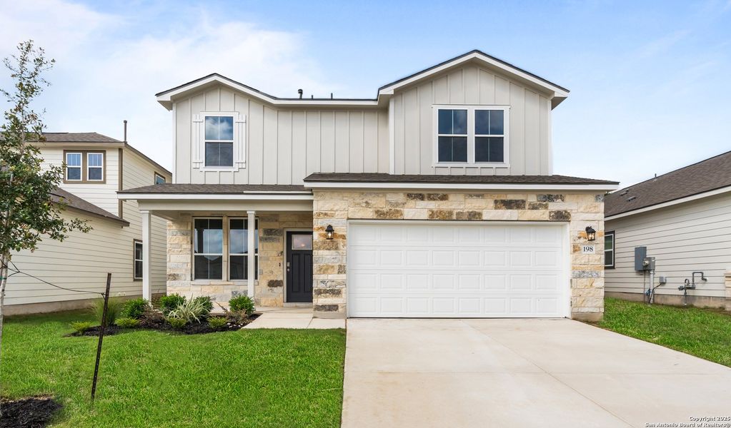 Front exterior of a new home in The Meadows at Hunters Ranch, San Antonio, TX, highlighting curb appeal (Image 18).