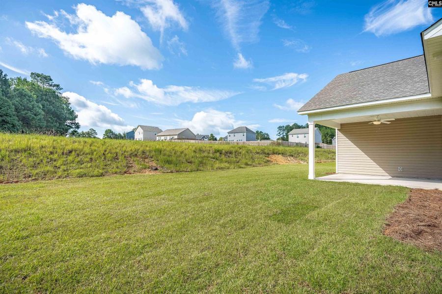 Exterior details and patio area of a home in Rolling Hills, Prosperity (Image 20).