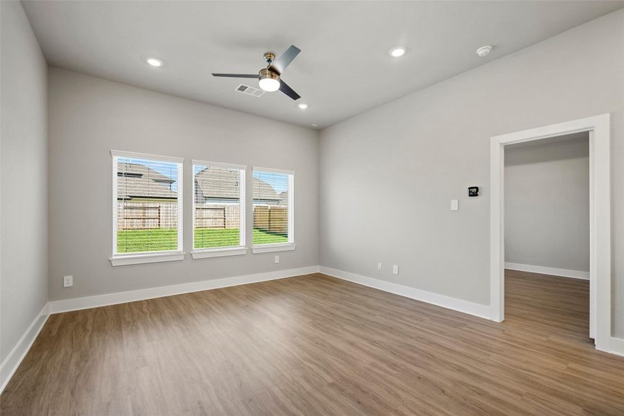 Luxury vinyl plank flooring and soft natural light create an airy, inviting feel.