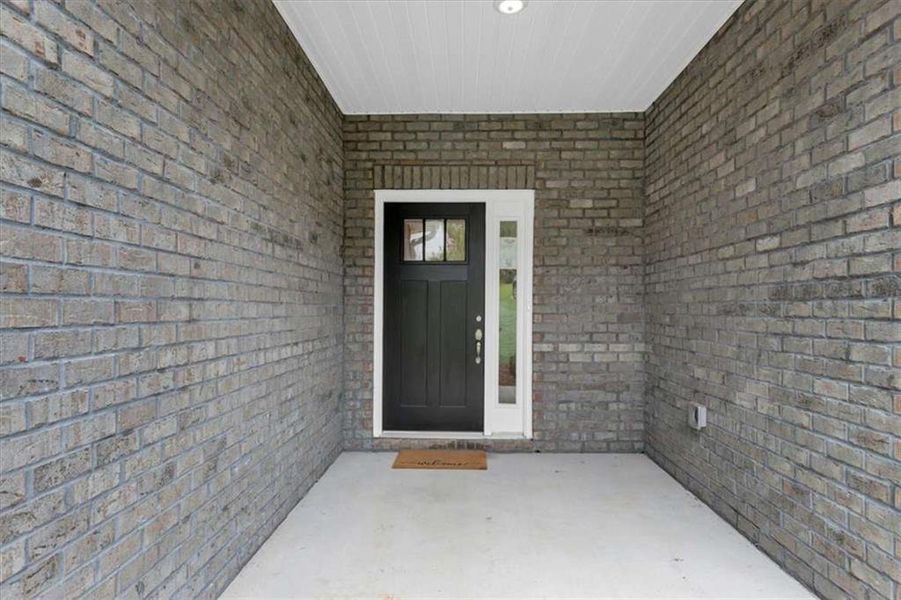 Exterior details and patio area of a home in Scarlett Place, Bowdon (Image 3).
