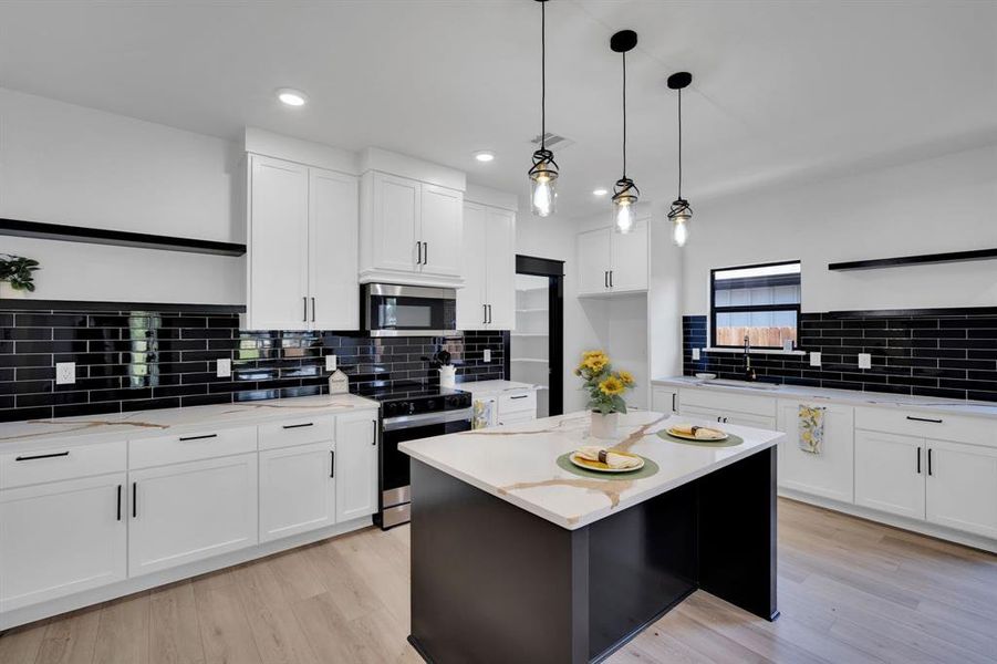 Loads of counter space and breakfast bar.