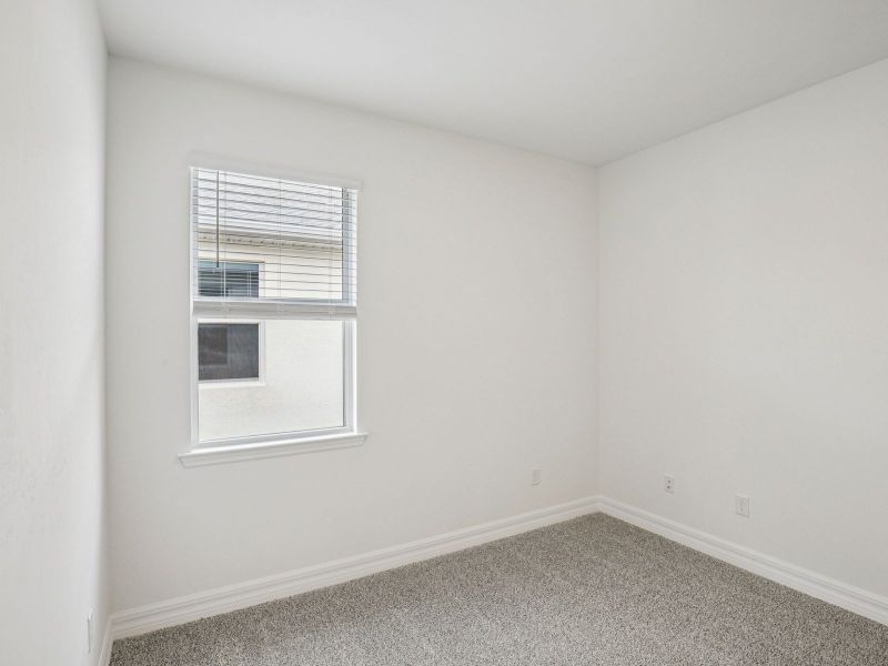 Spacious, unfurnished interior of a new home in Crescent Lakes - Reserve Series, Punta Gorda (Image 14).