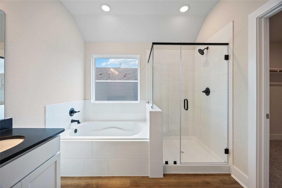 The garden tub and large shower provide the perfect space to relax.