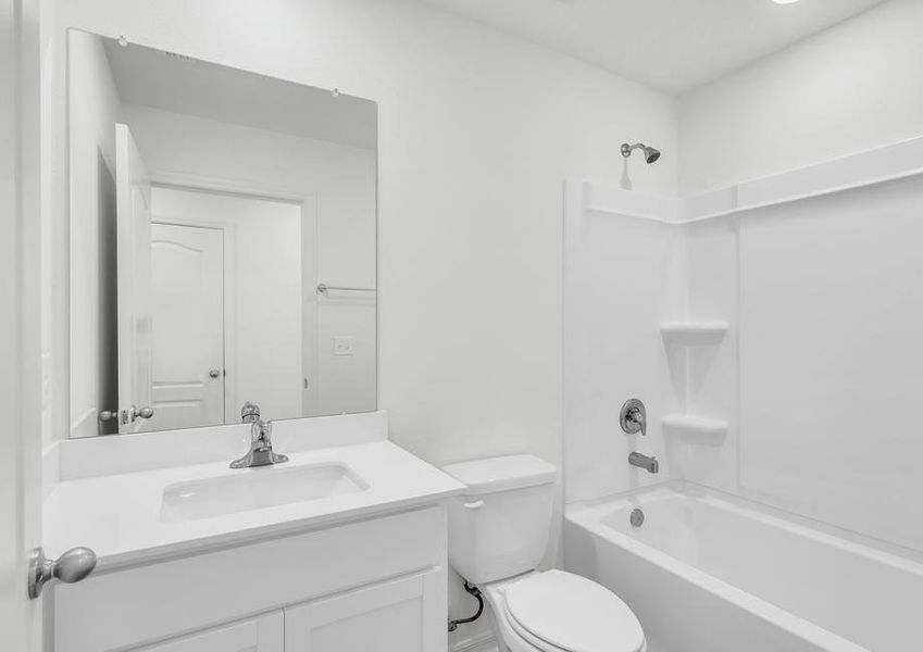 The second bathroom includes a dual shower and bathtub