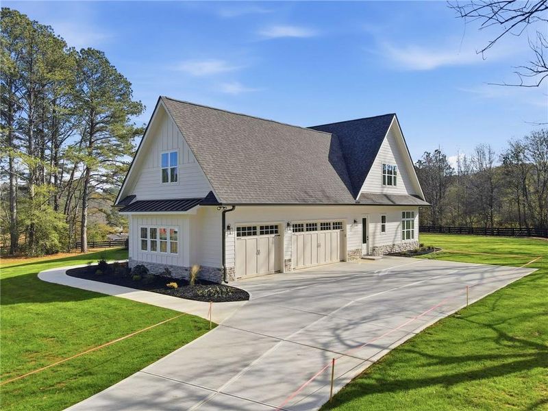 Front exterior of a new home in , Canton, GA, highlighting curb appeal (Image 1).