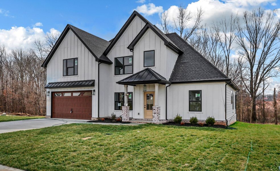 Front exterior of a new home in Bellshire, Clarksville, TN, highlighting curb appeal (Image 1). Front exterior of a new home in Bellshire, Clarksville, TN, highlighting curb appeal (Image 1).