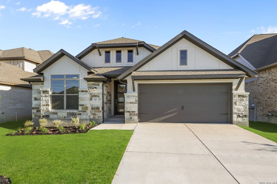 Front exterior of a new home in Nopal Valley, San Antonio, TX, highlighting curb appeal (Image 24).