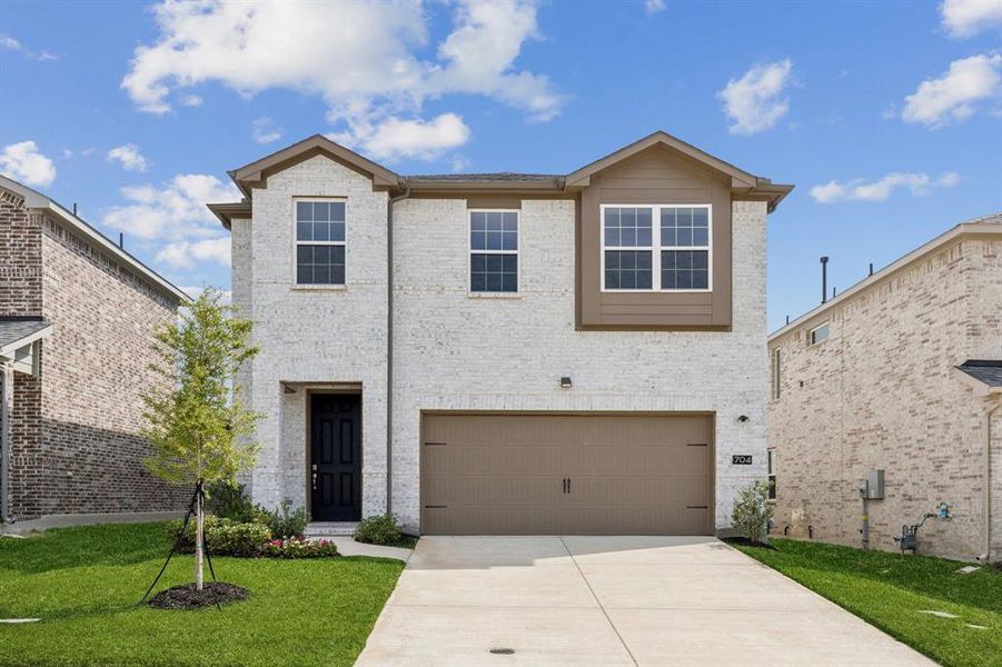 Front exterior of a new home in AnaCapri, Anna, TX, highlighting curb appeal (Image 1). Front exterior of a new home in AnaCapri, Anna, TX, highlighting curb appeal (Image 1).