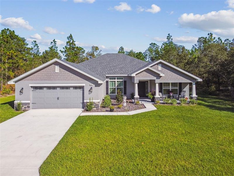 Front exterior of a new home in Sugarmill Woods, Homosassa, FL, highlighting curb appeal (Image 29).