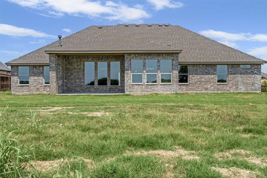Front exterior of a new home in , Godley, TX, highlighting curb appeal (Image 22).
