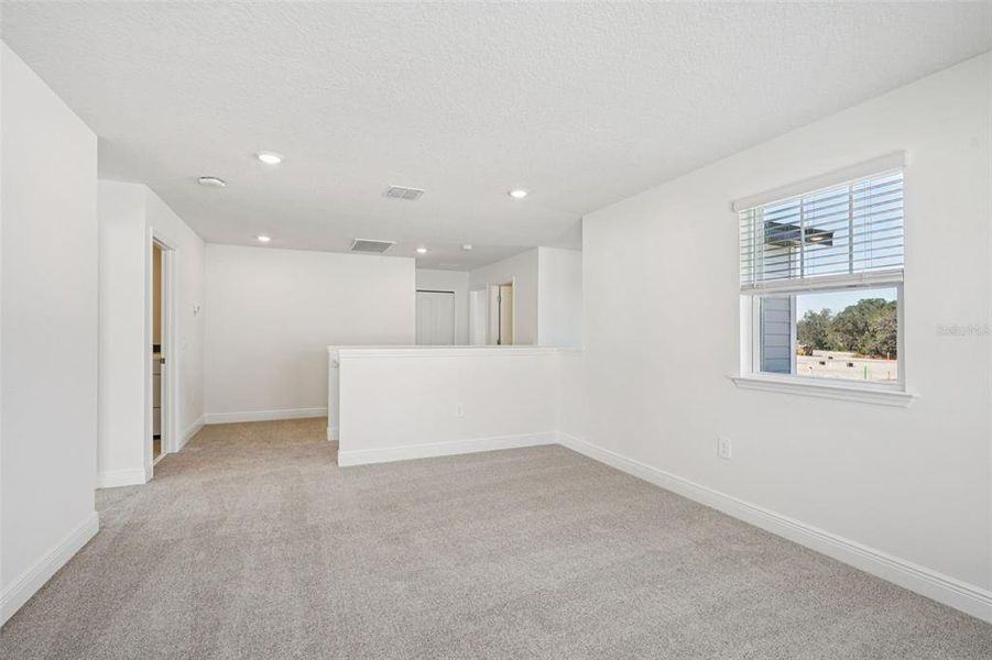 Spacious, unfurnished interior of a new home in The Reserve at Hammock Oaks - Signature Series, Lady Lake (Image 23).