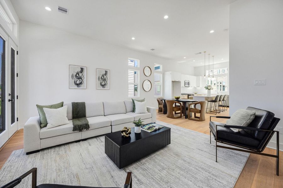 Another view of the living room open to the dining and kitchen areas.