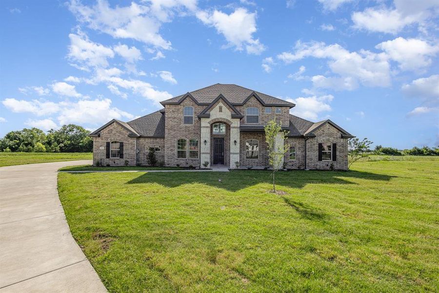 Front exterior of a new home in , Waxahachie, TX, highlighting curb appeal (Image 15).