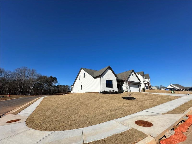 Front exterior of a new home in Summerlin, Winder, GA, highlighting curb appeal (Image 26).