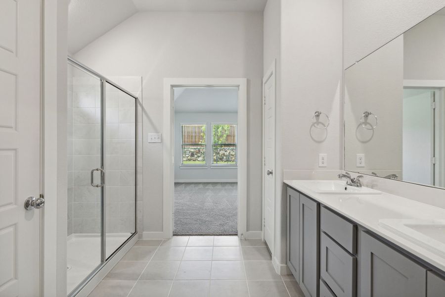 Primary bathroom in the Quartz home plan by Trophy Signature Homes – REPRESENTATIVE PHOTO