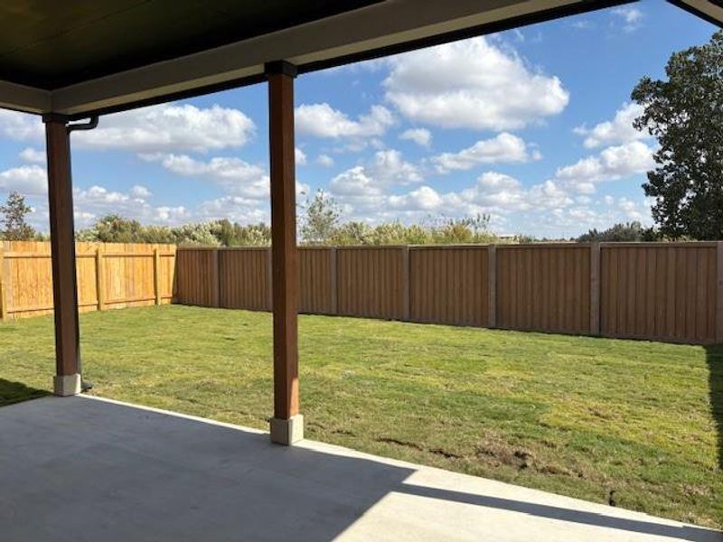 Fenced backyard featuring a patio Fenced backyard featuring a patio
