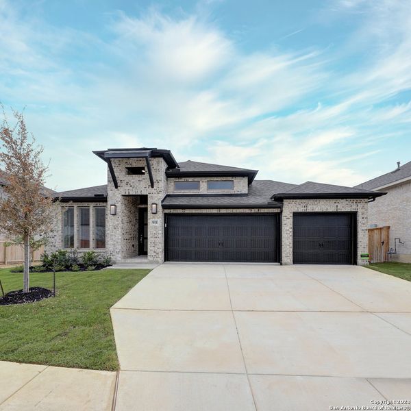Front exterior of a new home in Weston Oaks 55', San Antonio, TX, highlighting curb appeal (Image 2). Front exterior of a new home in Weston Oaks 55', San Antonio, TX, highlighting curb appeal (Image 2).