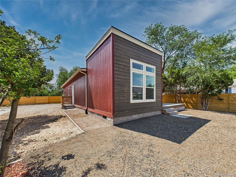 Front exterior of a new home in , Pueblo West, CO, highlighting curb appeal (Image 25).