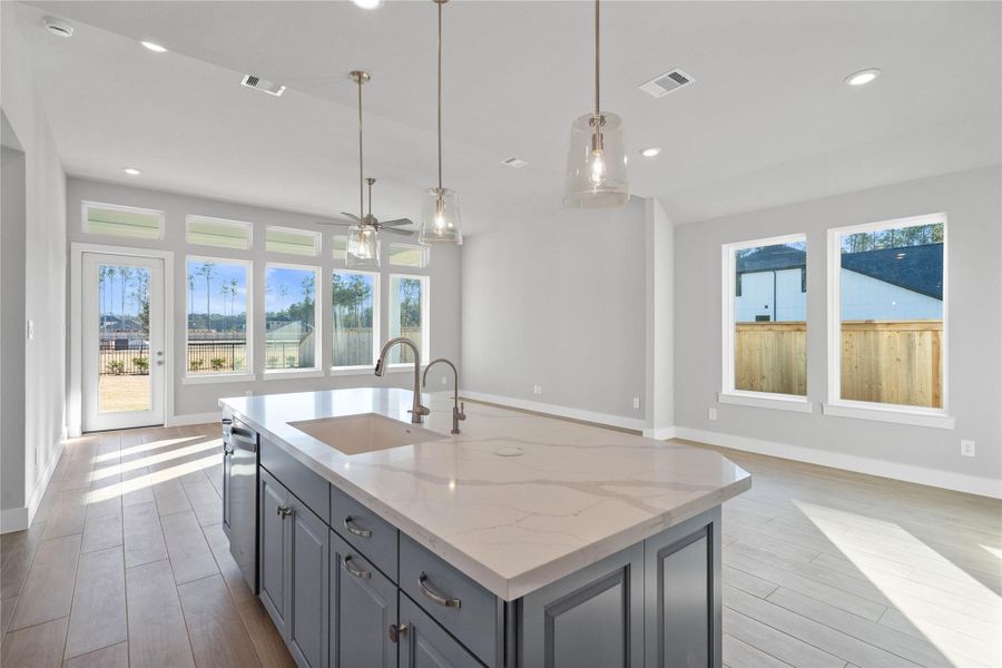 The intentional open design fosters a deep sense of connection between all three primary living zones. Sightlines remain clear from the sink to the sofa, promoting inclusive living and effortless entertaining.