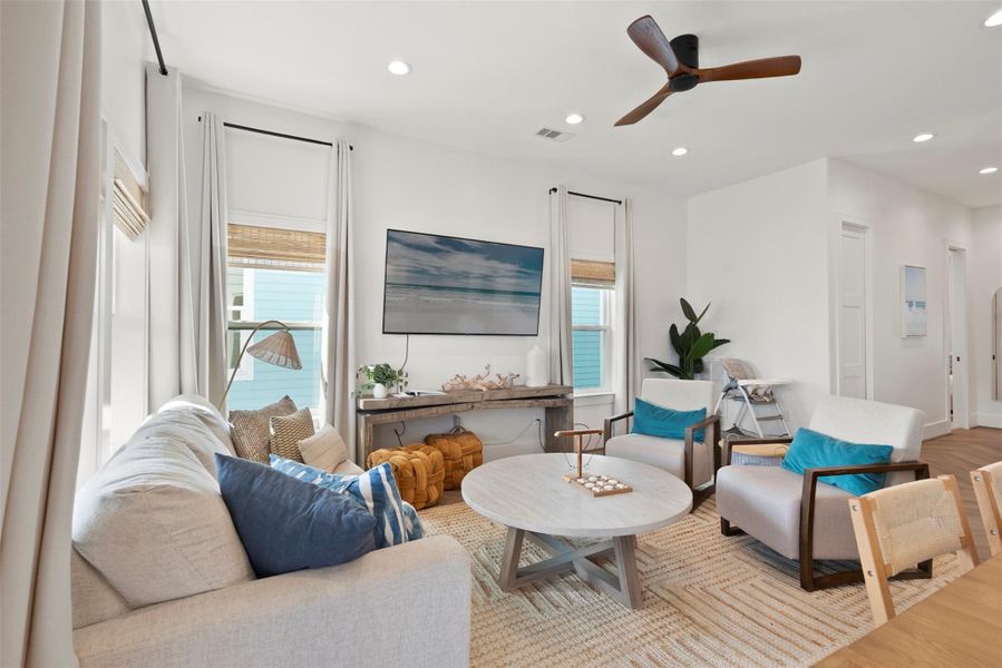 This open-concept space blends kitchen, dining, and living areas in a serene Modern Coastal style. Light wood tones, soft textures, and wave-inspired artwork evoke a relaxed coastal vibe, while clean lines and contemporary furnishings keep the look fresh and refined. This open-concept space blends kitchen, dining, and living areas in a serene Modern Coastal style. Light wood tones, soft textures, and wave-inspired artwork evoke a relaxed coastal vibe, while clean lines and contemporary furnishings keep the look fresh and refined.