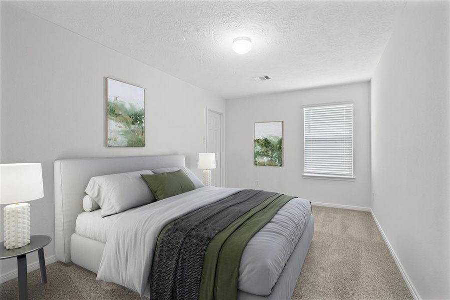 This secondary bedroom features high ceilings, custom paint, plush carpet, and a large window with privacy blinds!