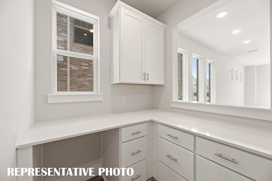 You'll find the perfect pocket office with optional built in cabinets in our Alexander plan.  REPRESENTATIVE PHOTO