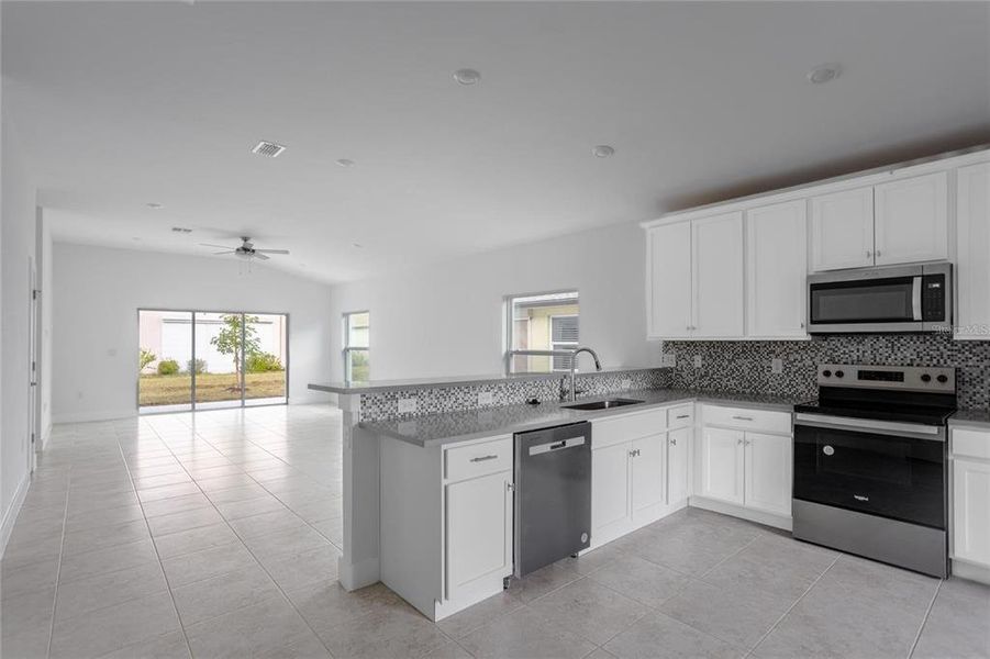 Furnished interior view inside a new home in , Port Charlotte (Image 6).