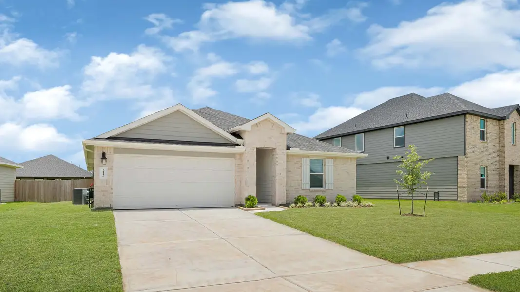 Front exterior of a new home in Evergreen, Rosenberg, TX, highlighting curb appeal (Image 2). Front exterior of a new home in Evergreen, Rosenberg, TX, highlighting curb appeal (Image 2).