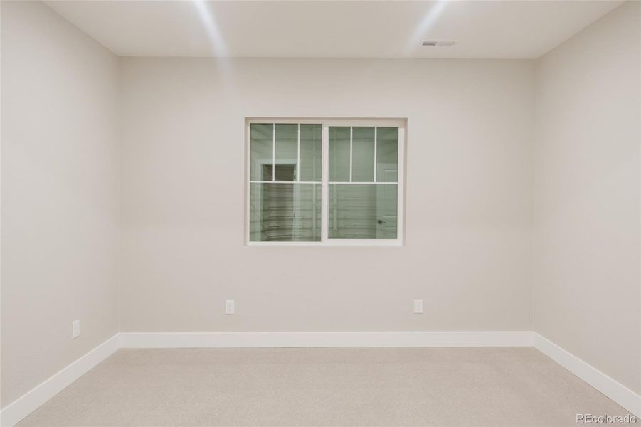 This basement-level bedroom has a walk-in closet This basement-level bedroom has a walk-in closet