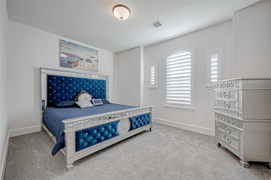 Three Upstairs Bedrooms: Each with a private ensuite and walk-in closet, these spacious rooms offer comfort and privacy for family or guests. (3 of 3)