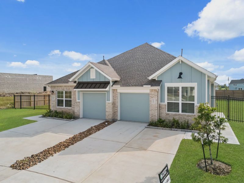 Representative exterior photo of a completed home built from the Chalet by Chesmar Homes in Meridiana Townhomes, Iowa Colony, TX (Image 26).