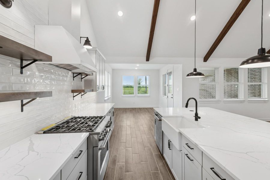 Gorgeous kitchen with light grey cabinets and quartz countertops Gorgeous kitchen with light grey cabinets and quartz countertops