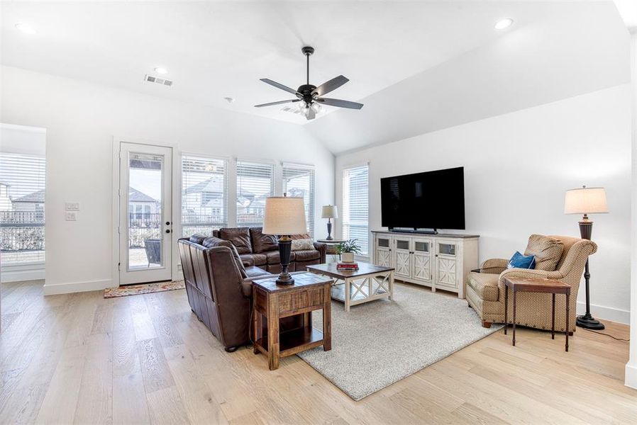 Large family room that overlooks the beautiful backyard.