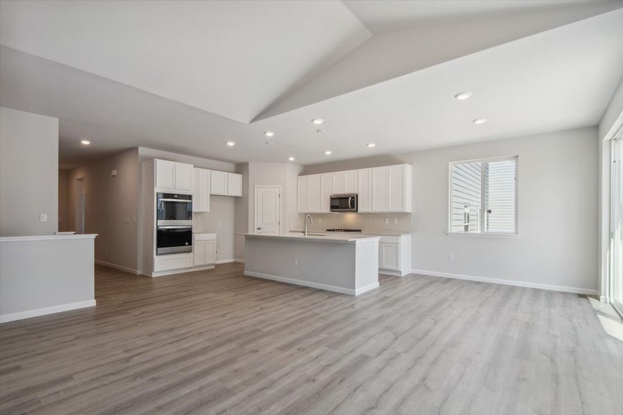 A large kitchen with white cabinets.