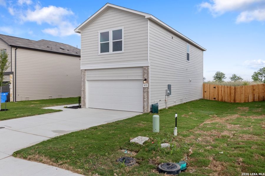 Exterior details and patio area of a home in Woodside Farms, Seguin (Image 3).
