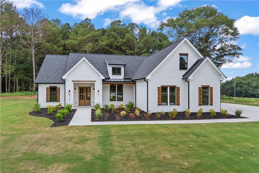 Front exterior of a new home in , Covington, GA, highlighting curb appeal (Image 32).