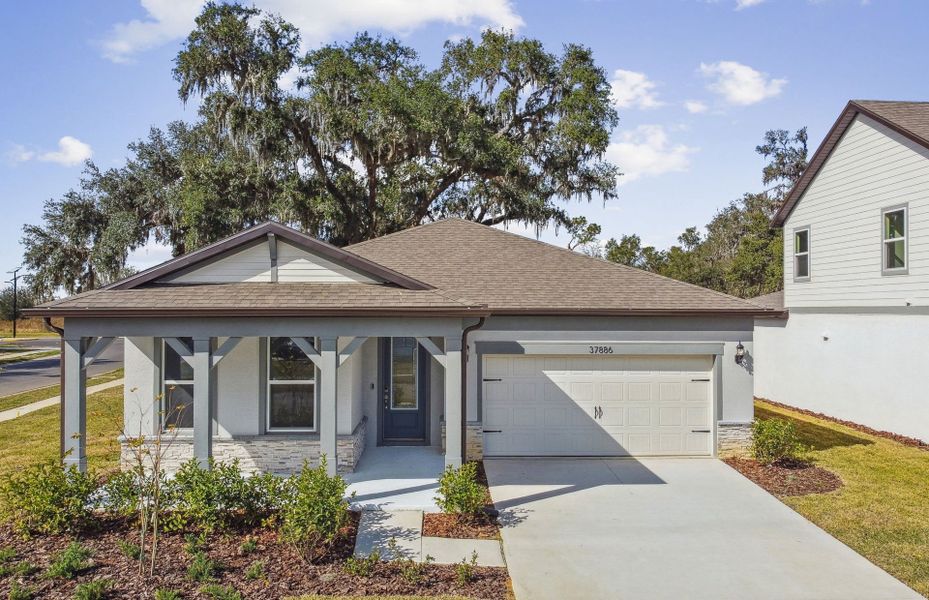Representative exterior photo of a completed home built from the Coral by Pulte Homes in Riverwood, Zephyrhills, FL (Image 20).