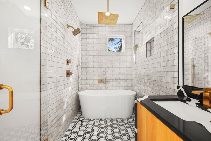 Full bathroom featuring tile walls, a freestanding tub, vanity, a shower stall, and recessed lighting Full bathroom featuring tile walls, a freestanding tub, vanity, a shower stall, and recessed lighting