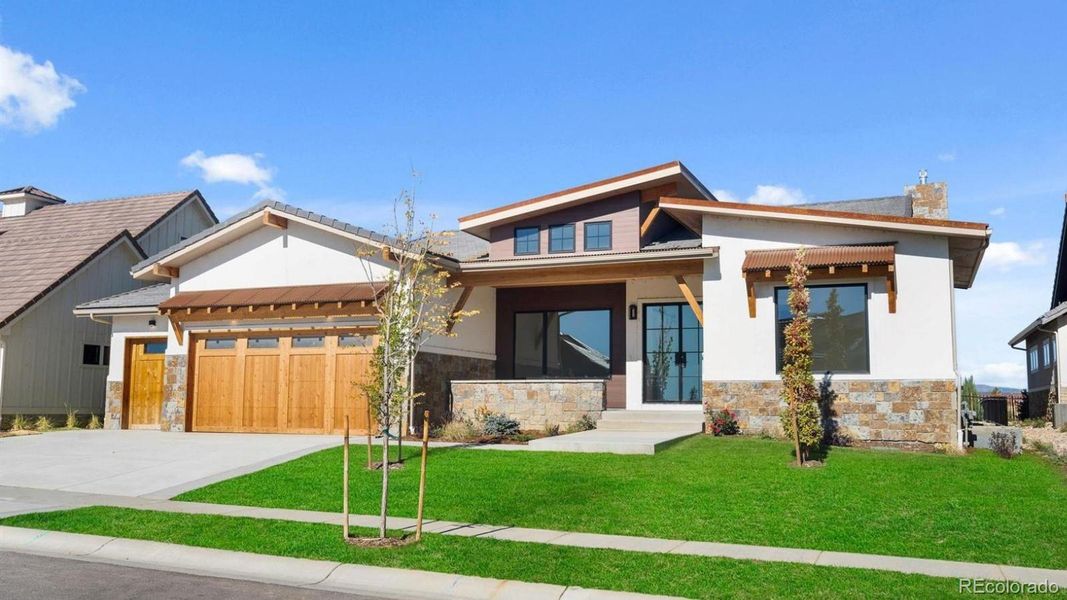 Front exterior of a new home in , Berthoud, CO, highlighting curb appeal (Image 19).