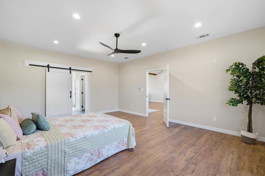 Private primary bedroom on one side of the home