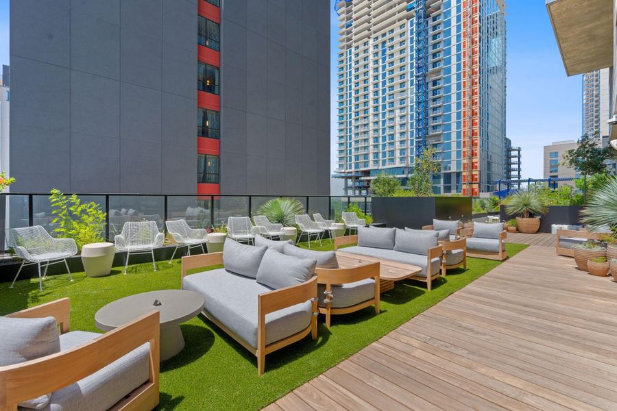 12th floor outdoor lounge equipped with afireplace and flat screen tv, perfect for enjoying the an outdoor escape.