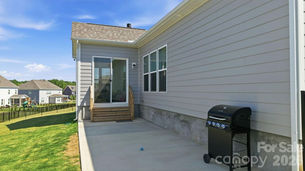 Exterior details and patio area of a home in Estates at Sugar Creek, Indian Land (Image 30).
