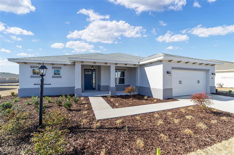 Exterior details and patio area of a home in On Top of the World Communities, Ocala (Image 3).