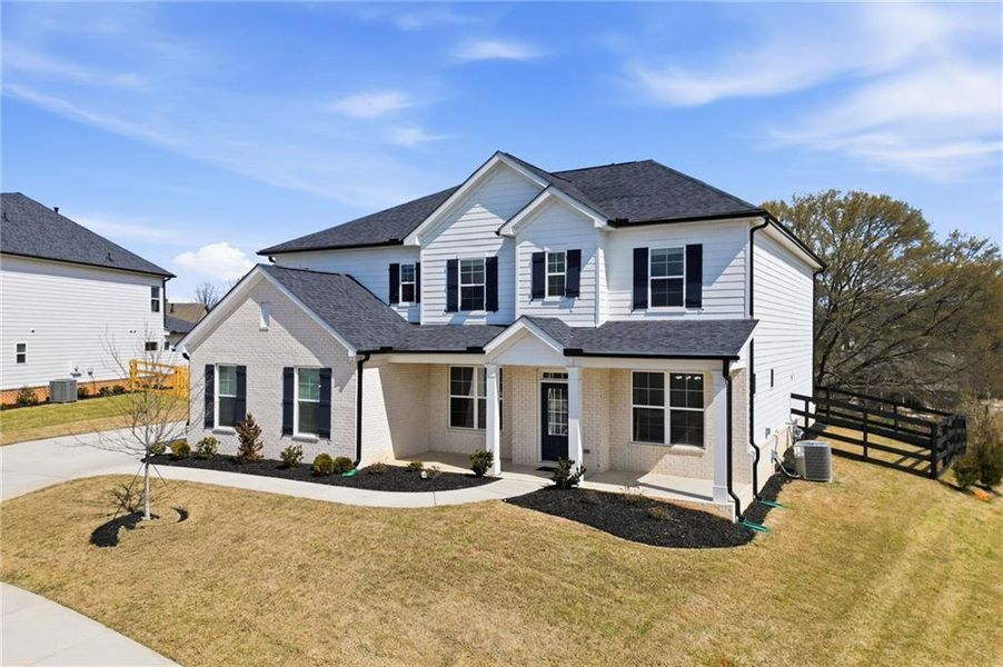 Front exterior of a new home in Carmichael Farms, Canton, GA, highlighting curb appeal (Image 24).