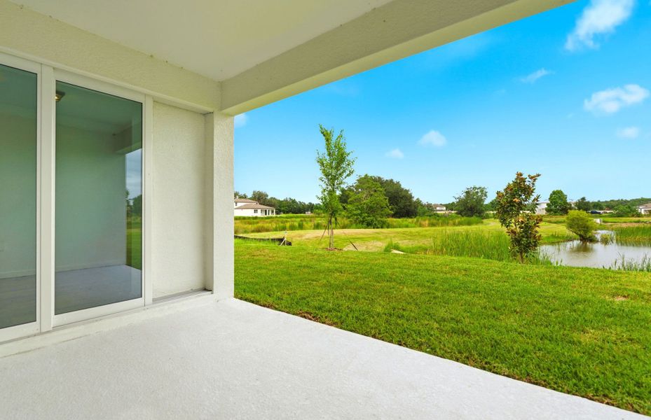 Exterior details and patio area of a home in Riverwood, Zephyrhills (Image 4).