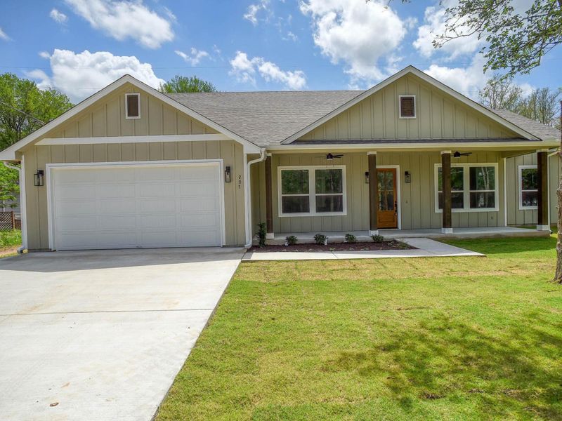 Front exterior of a new home in , Bastrop, TX, highlighting curb appeal (Image 2). Front exterior of a new home in , Bastrop, TX, highlighting curb appeal (Image 2).
