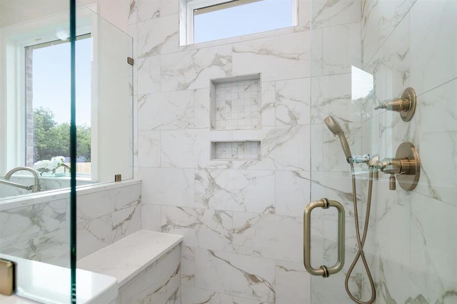 Full bath featuring a marble finish shower Full bath featuring a marble finish shower